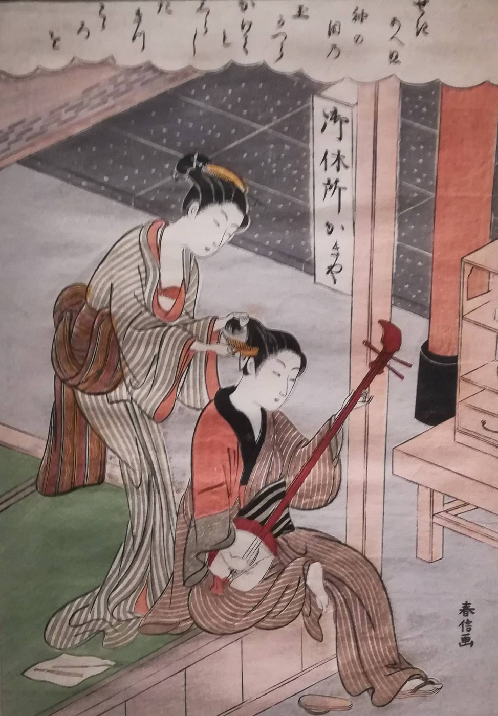 Osen della casa da tè Kagiya che pettina un giovanotto - Suzuki Harunobu