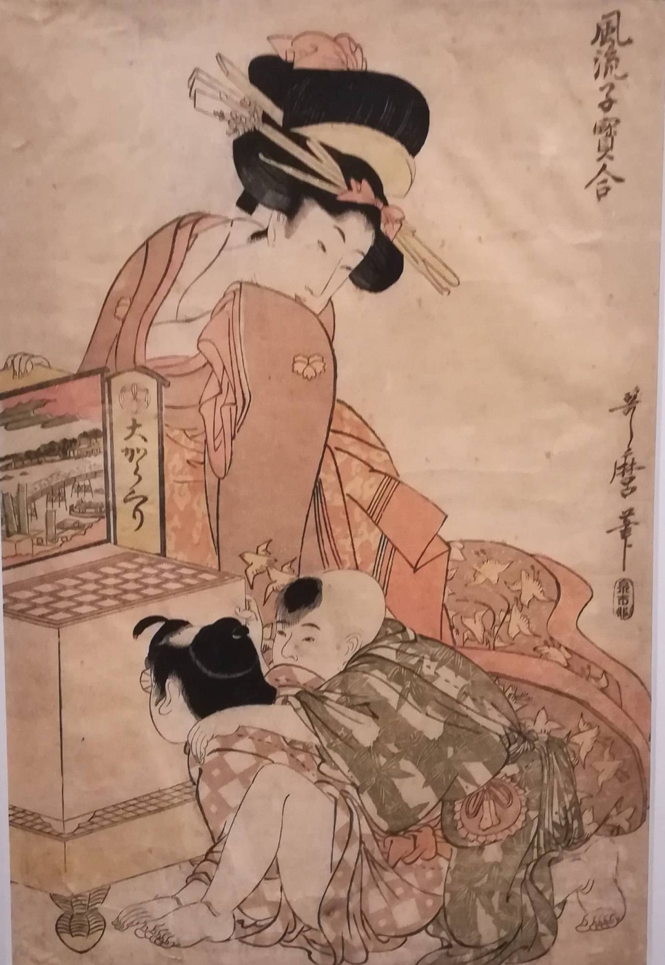 Bambini che si divertono osservando le immagini di vedute (meganee) con il visore ottico - Kitagawa Utamaro