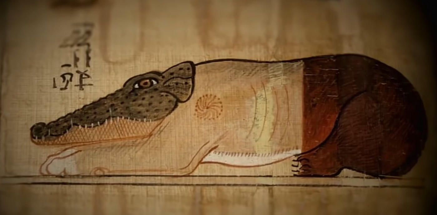 Ammit una creatura terrificante con la testa di coccodrillo il corpo di leone e le zampe posteriori d’ippopotamo